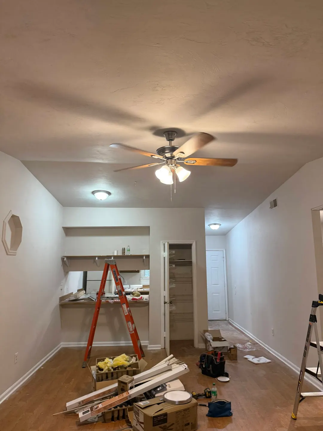 Installed ceiling fan with light in an interior living space